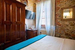 Postel nebo postele na pokoji v ubytování Luxury Corte Di Re Artù