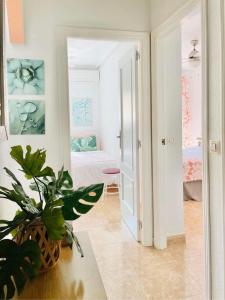 a room with a door open to a bedroom at Beautiful location in Cabo Roig with a private roof top terrace at Playamarina II in Orihuela