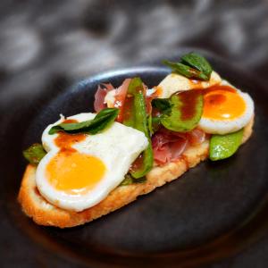 a sandwich with eggs and vegetables on a plate at Casa 1881 in Riobamba