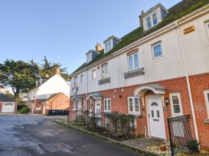 an empty street in front of a brick building at Admirals View in Lyme Regis