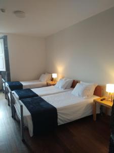 Ένα ή περισσότερα κρεβάτια σε δωμάτιο στο Azores Youth Hostels - Pico