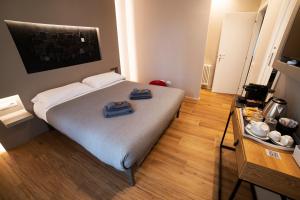 Postel nebo postele na pokoji v ubytování LUCRINO 45 by Ale