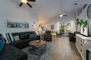 a living room with a couch and a table at 124DORN-Highlands Villa (S) in Davenport