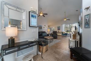 a living room with a table and a couch at 124DORN-Highlands Villa (S) in Davenport