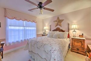 a bedroom with a bed and a ceiling fan at Serene Dayton Vacation Rental with Large Yard! in Dayton