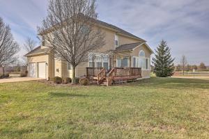 a house with a porch and a large yard at Serene Dayton Vacation Rental with Large Yard! in Dayton