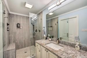 a bathroom with a sink and a shower at Ranch-Style Home 7 Mi to Downtown Greensboro! in Greensboro +18 photos