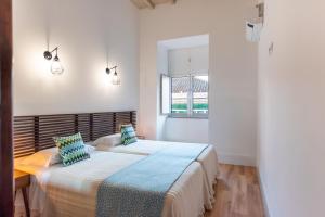 En eller flere senge i et værelse på Feel Discovery Homes in Douro