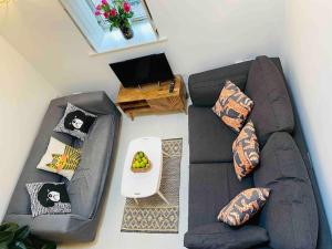 an overhead view of a living room with a couch at The Owl House Cottage in Welsh Newton Common