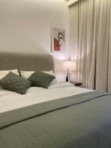 a bedroom with a large bed and a window at Out of Mood ! luxury stay!! Abu Dhabi Yas Island in Abu Dhabi