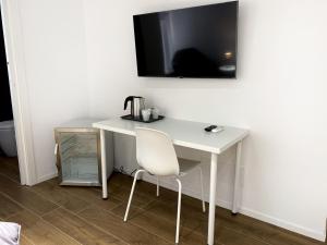 TV a/nebo společenská místnost v ubytování Business Home Via Isonzo B&B