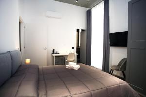 Postel nebo postele na pokoji v ubytování Business Home Via Isonzo B&B