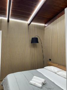 a bedroom with a bed with two towels on it at Sweet Dream in Caserta