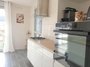Kuchyňa alebo kuchynka v ubytovaní Cozy-Room Appartement