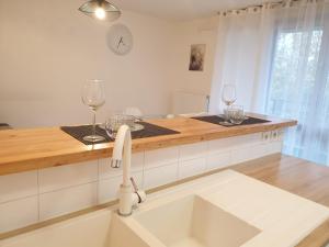 Kuchyňa alebo kuchynka v ubytovaní Cozy-Room Appartement