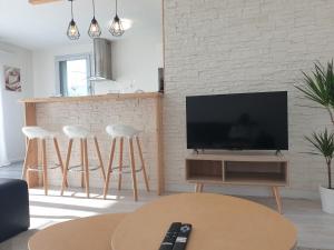 Televízia a/alebo spoločenská miestnosť v ubytovaní Cozy-Room Appartement