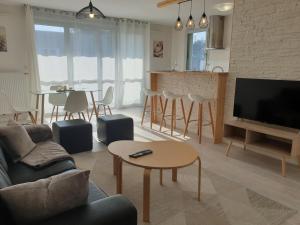 Televízia a/alebo spoločenská miestnosť v ubytovaní Cozy-Room Appartement