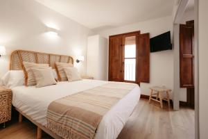 Postel nebo postele na pokoji v ubytování La Plaza Hostal