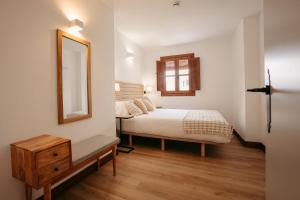 Postel nebo postele na pokoji v ubytování La Plaza Hostal