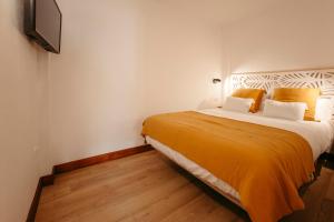 Postel nebo postele na pokoji v ubytování La Plaza Hostal