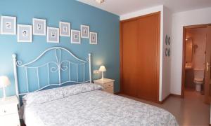 Postel nebo postele na pokoji v ubytování Apartamento con vistas, ascensor y parking en Portosín