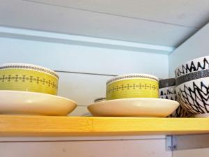 a shelf with three bowls on top of it at 4 person holiday home in GRISSLEHAMN in Grisslehamn