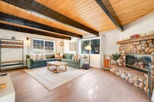 a living room with a couch and a fireplace at Pine Den Cabin: Arcade+Fire Pit+BBQ in Sugarloaf