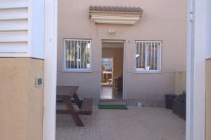 a house with a picnic table in front of it at Fantástica casa con piscina y playa ,Torredembarra-Tarragona in Pobla de Montornés