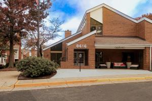 a brick building with the words on it at Tysons Corner Suites, A Baymont by Wyndham in Vienna