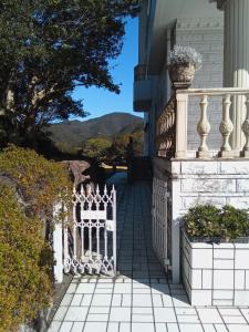 a white fence on the side of a house at Cafe panorama - Vacation STAY 96734v in Esumi