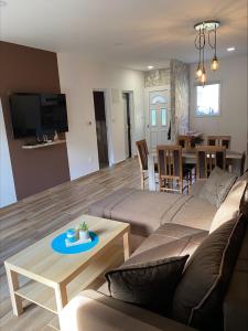a living room with a couch and a table at Blue Lagoon Apartments in Crni Vrh