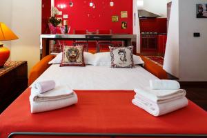 Ένα ή περισσότερα κρεβάτια σε δωμάτιο στο AmoCatania Apartment