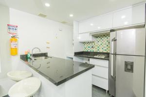 Kuchyň nebo kuchyňský kout v ubytování Loft moderno en El Poblado con vista y parqueadero Mio Lofts + 37 fotografií