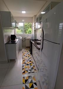 Dapur atau dapur kecil di Apartamento aconchegante 2 quartos próximo à Miguel Sutil