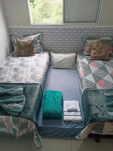 Katil atau katil-katil dalam bilik di Apartamento aconchegante 2 quartos próximo à Miguel Sutil