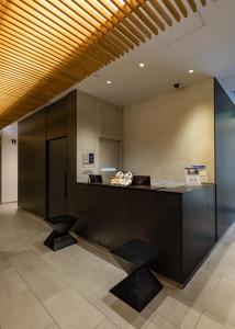 a lobby with a reception desk in a building at Best Western Hotel Fino Tokyo Akihabara in Tokyo
