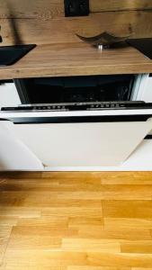 a white stove top oven sitting in a kitchen at Apartment Holesovice, garden, garage in Prague