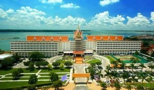 an aerial view of a resort with a large building at Hotel Cambodiana in Phnom Penh