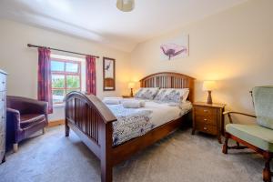 Säng eller sängar i ett rum på Tower Cottage