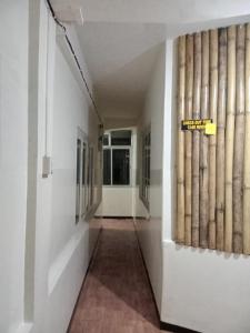 a hallway in a building with baseball bats on the wall at Southern Lodge, Kohima, Nagaland in Kohīma