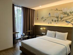 Ένα ή περισσότερα κρεβάτια σε δωμάτιο στο Jacayl Hotel TCG
