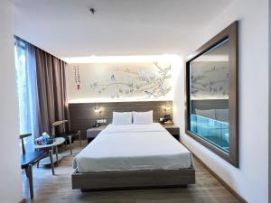 Ένα ή περισσότερα κρεβάτια σε δωμάτιο στο Jacayl Hotel TCG