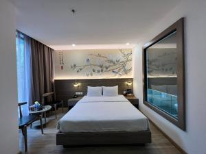 Ένα ή περισσότερα κρεβάτια σε δωμάτιο στο Jacayl Hotel TCG