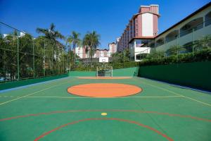 a basketball court with a basketball hoop on it at Hotel Hot Springs 528 in Caldas Novas