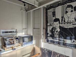 a mural of a man on a wall in a room at Kun living in Taitung City