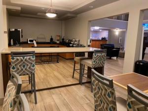 an office with chairs and a bar in a room at Best Western Windsor Inn and Suites in Danville