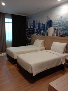 Postel nebo postele na pokoji v ubytování GiiA Sanno Hotel Pluit