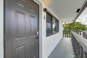 a door on the side of a building at Modern & Beachy-Rlx space for 6ppl in Fort Lauderdale