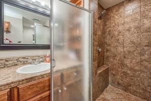 a bathroom with a shower and a sink at Renovated home minutes from Fresno State / Airport in Fresno