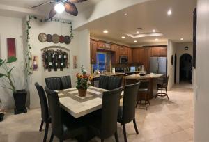 a kitchen and dining room with a table and chairs at ACCESS - BEACH Penthouse PAPAS and BEER 2 miles WIFI in Rosarito